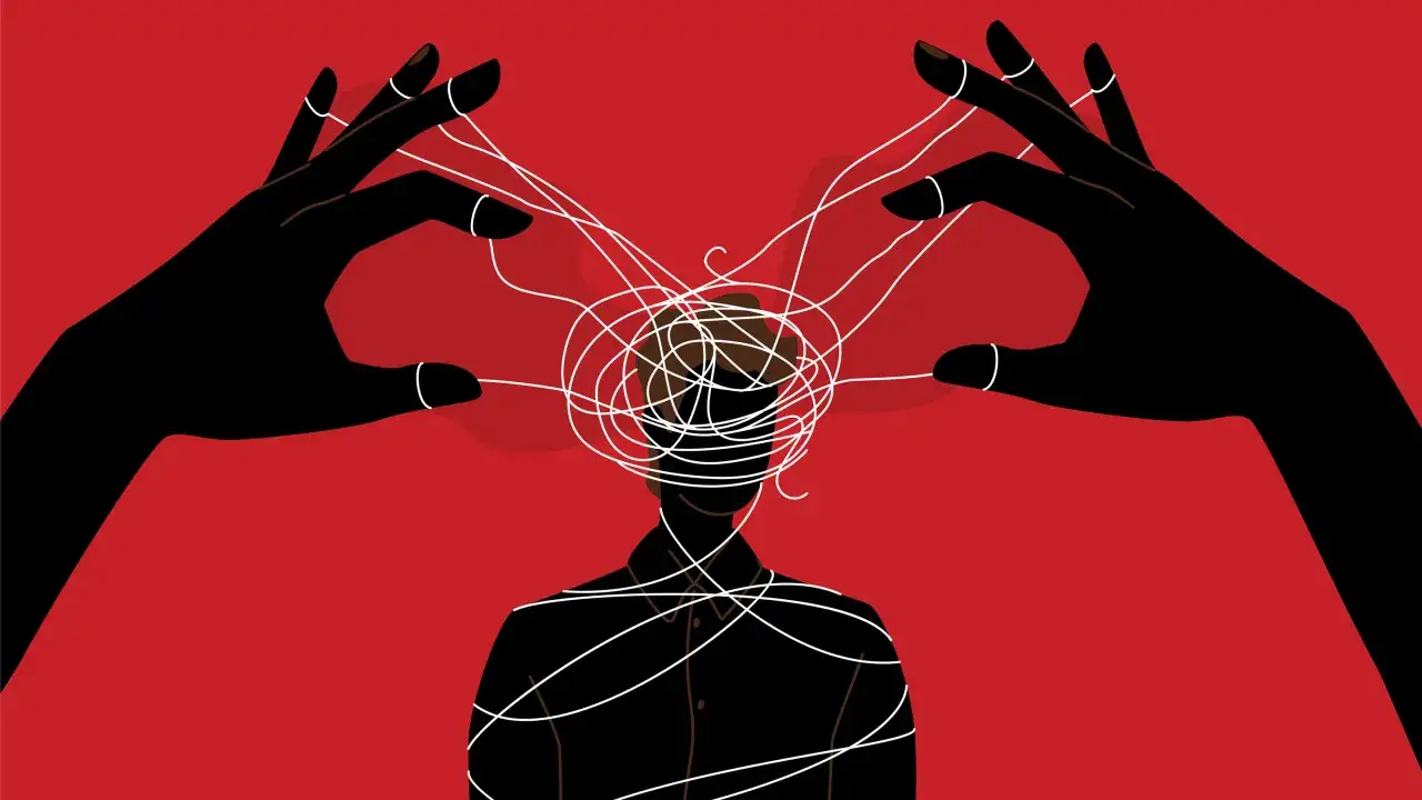 Mani nere manipolano fili aggrovigliati attorno alla testa di una persona, illustrando il gaslighting significato.